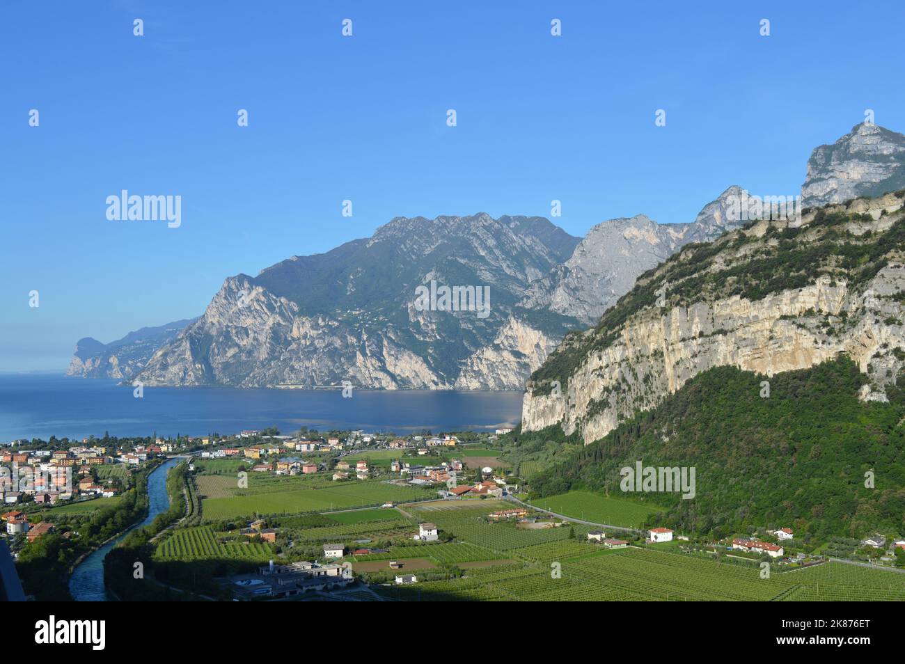 View to Linfano and Torbole, Monte Brione and Lake Garda, blue sky, summer Stock Photo