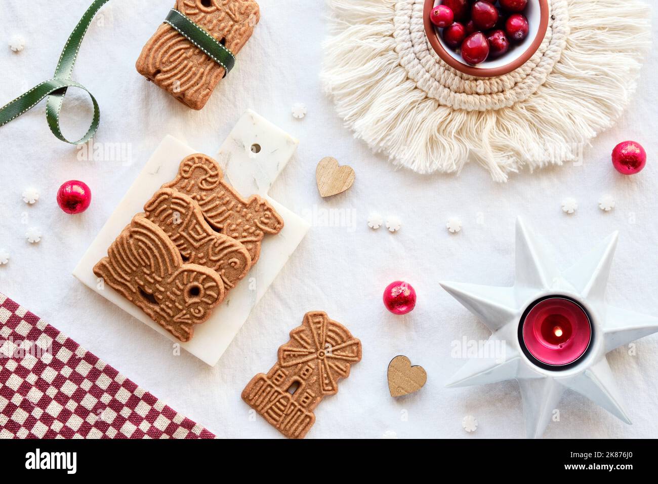 Speculoos or Spekulatius, Christmas biscuits, chocolate balls and ribbon on  off white textile tablecloth. Traditional German cookies for Xmas, Advent  Stock Photo - Alamy