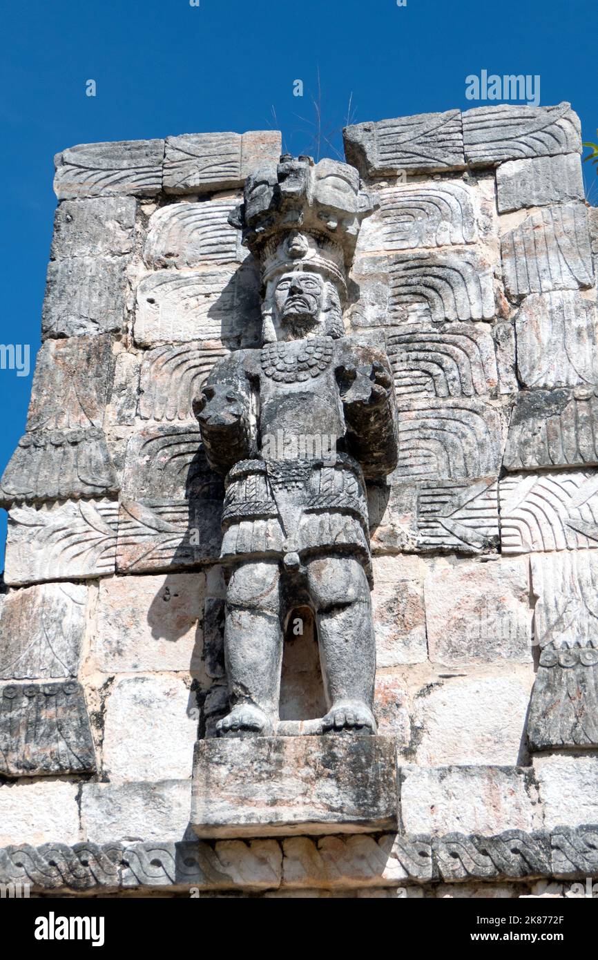Detail and close-up of bas-reliefs, decoration and statue on the Codz Poop palace at the Maya site of Kabah, Yucatan, Mexico. Mayan art on ancient bui Stock Photo