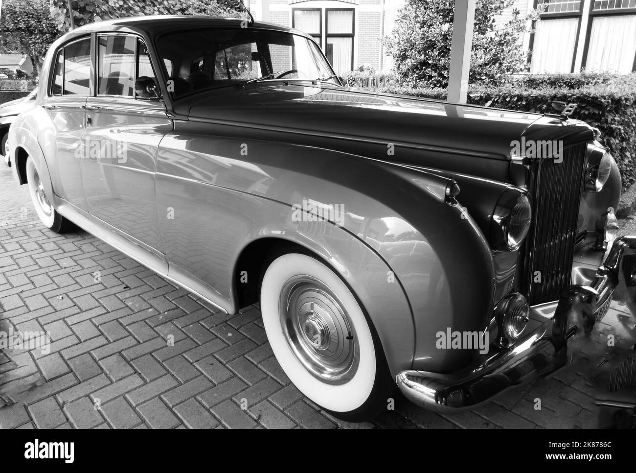 Den Ham, Netherlands - Sept 27 2022 A Bentley S1 with whitewall tires was parked. This car is produced from 1955 until 1959. The S1 was derived from t Stock Photo