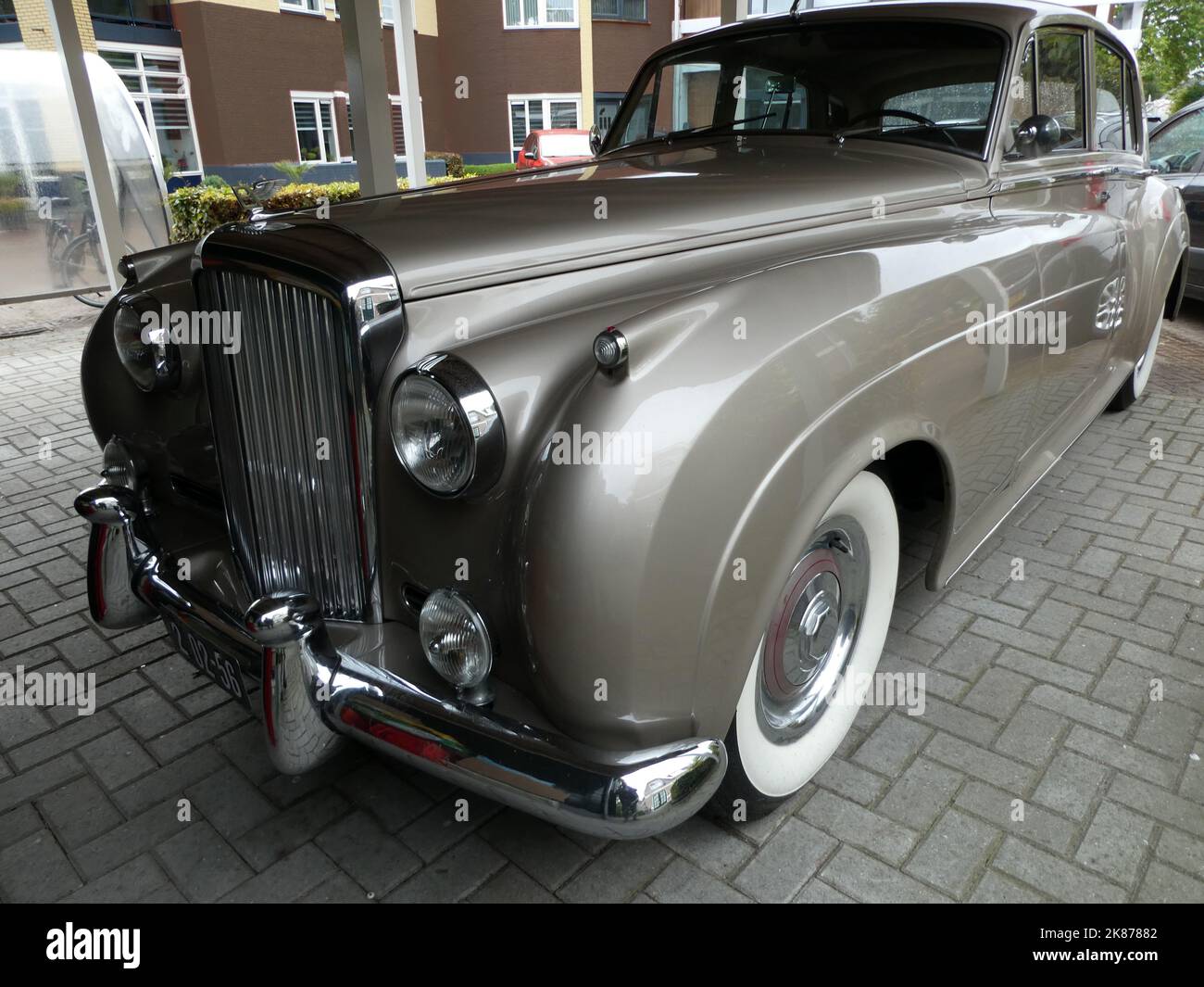 Den Ham, Netherlands - Sept 27 2022 A Bentley S1 with whitewall tires was parked. This car is produced from 1955 until 1959. The S1 was derived from t Stock Photo