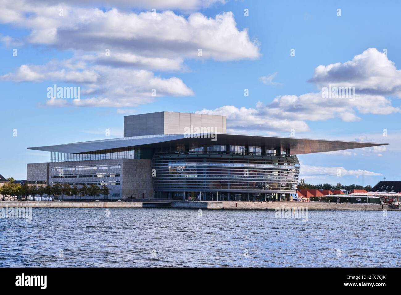 Copenhagen, Denmark - Sept 2022:  Water view of the Copenhagen Opera House (operaen), a contemporary building designed by architect Henning Larsen Stock Photo