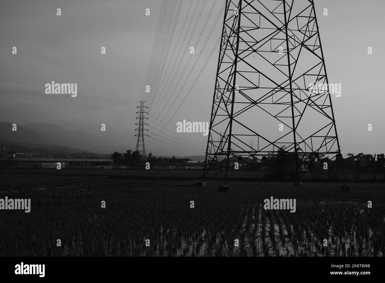 Monochrome photo, black and white photo of electricity distribution tower in Cikancung area - Indonesia Stock Photo