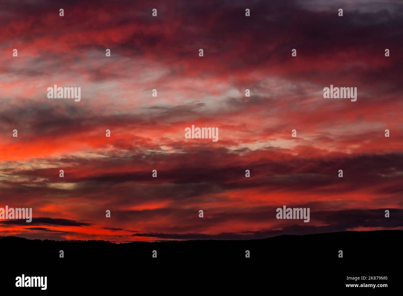 Beautiful sunset background with cloudy sky Stock Photo - Alamy