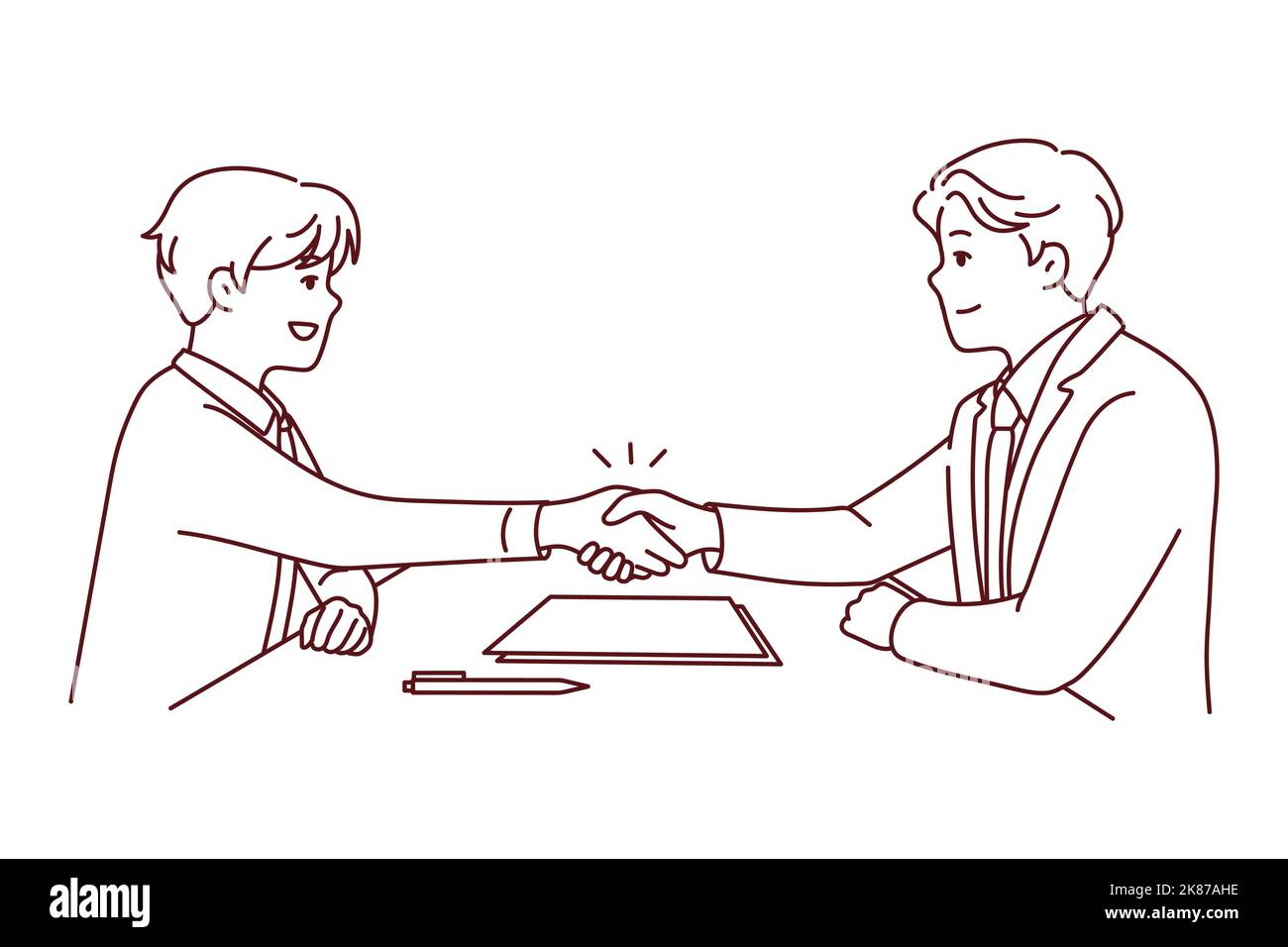 Smiling businessmen sit at desk shaking hands closing deal. Happy male