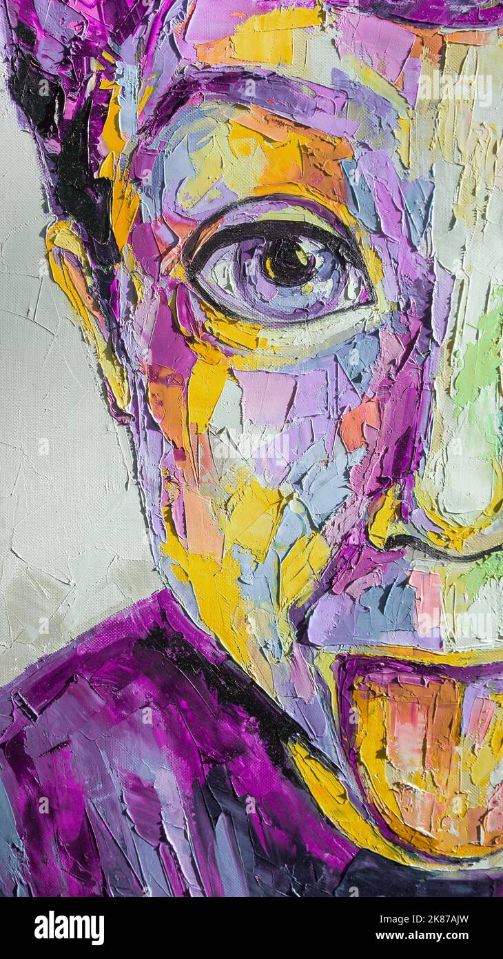 Oil portrait painting in multicolored tones. Abstract picture of a boy. Conceptual closeup of an oil painting and palette knife on canvas. Stock Photo