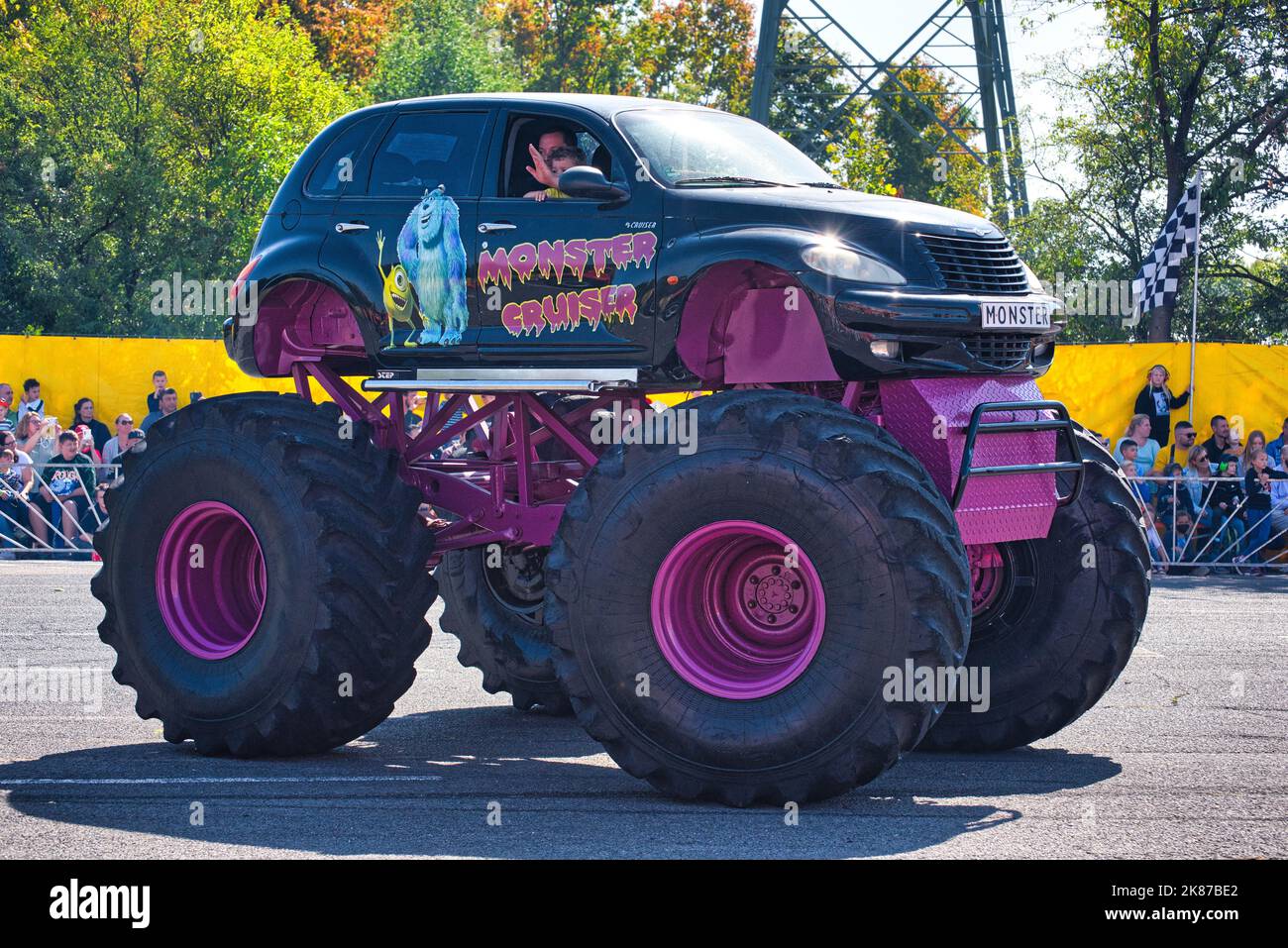 FRANKFURT AM MAIN, GERMANY - SEPT 2022: black purple Monster Truck Chrysler PT Cruiser, Monster Truck auto show. Stock Photo