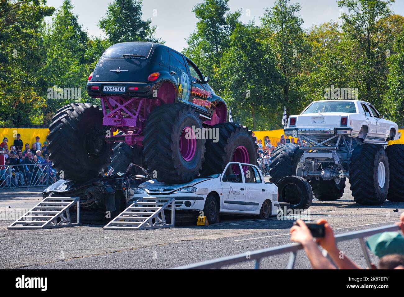 FRANKFURT AM MAIN, GERMANY - SEPT 2022: black purple Monster Truck Chrysler PT Cruiser, Monster Truck auto show. Stock Photo
