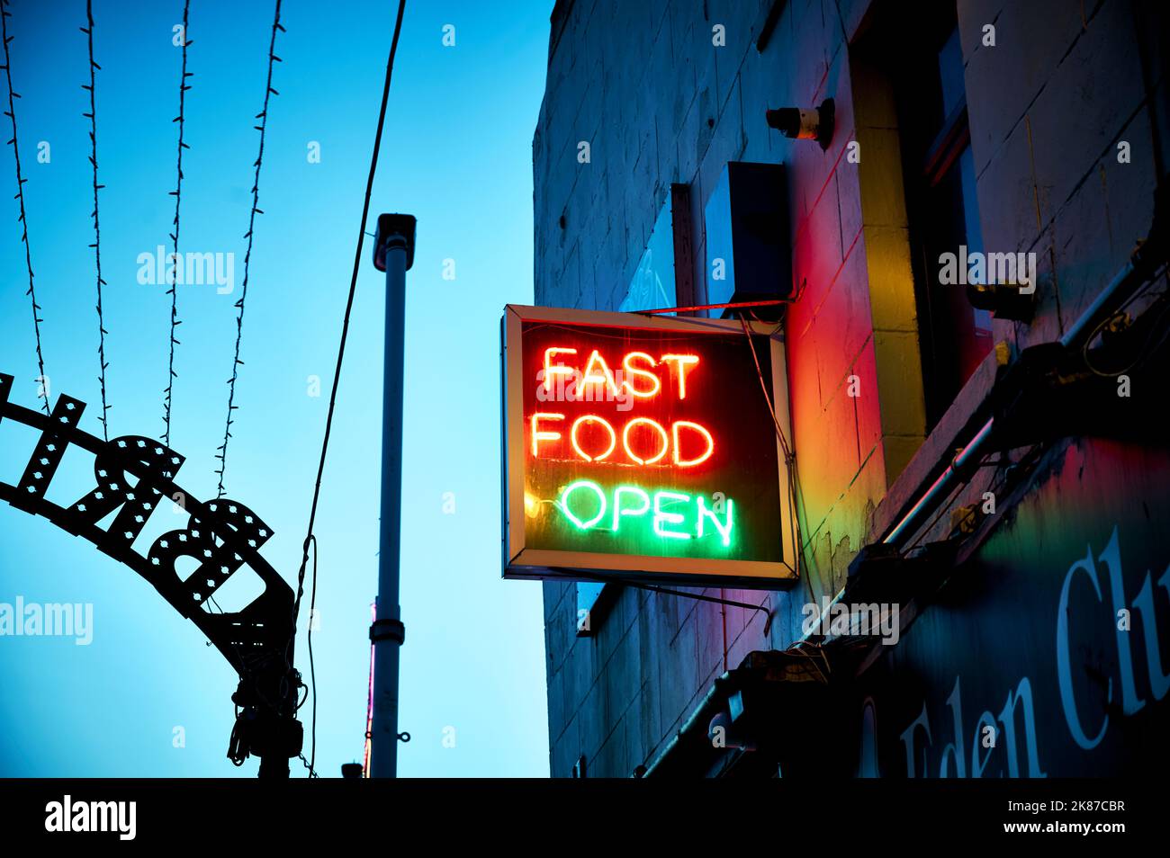 Fast food open neon sign above take away Stock Photo Alamy