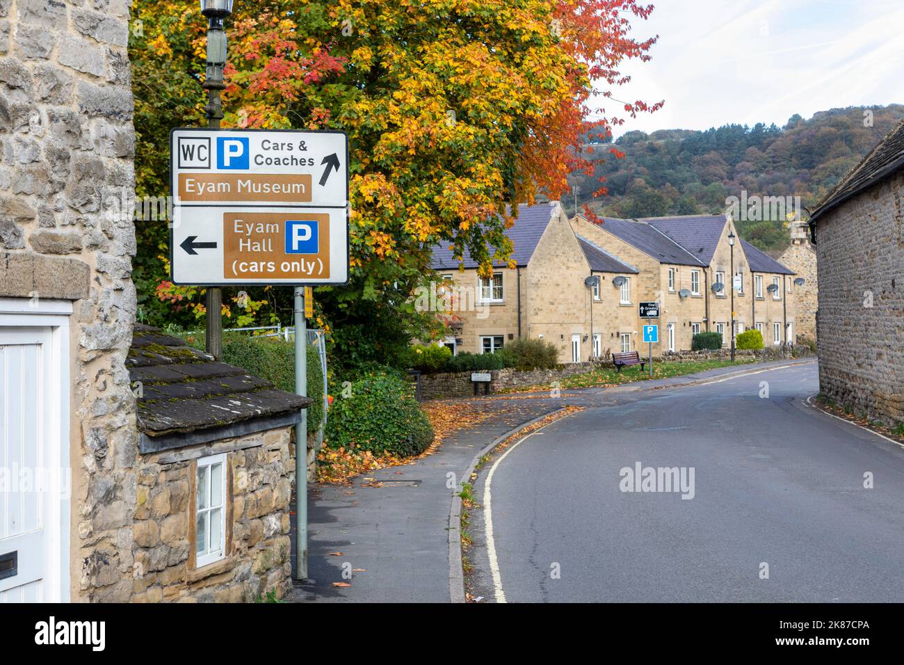 A direction sign in Eyam Village in the Peak District of Derbyshire. Stock Photo