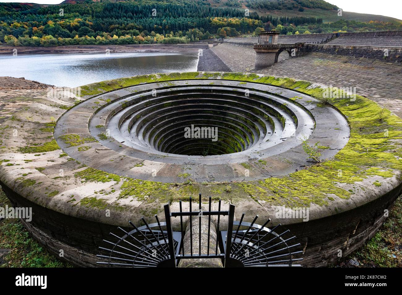 A Plughole drain at Ladybower reservoir in the Peak District at low water level. Stock Photo
