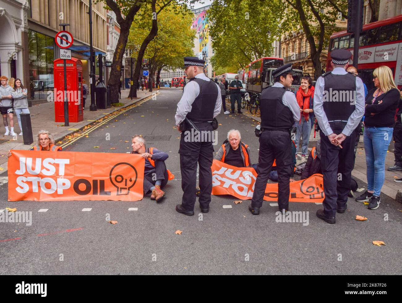 London, England, UK. 21st Oct, 2022. Just Stop Oil activists glued