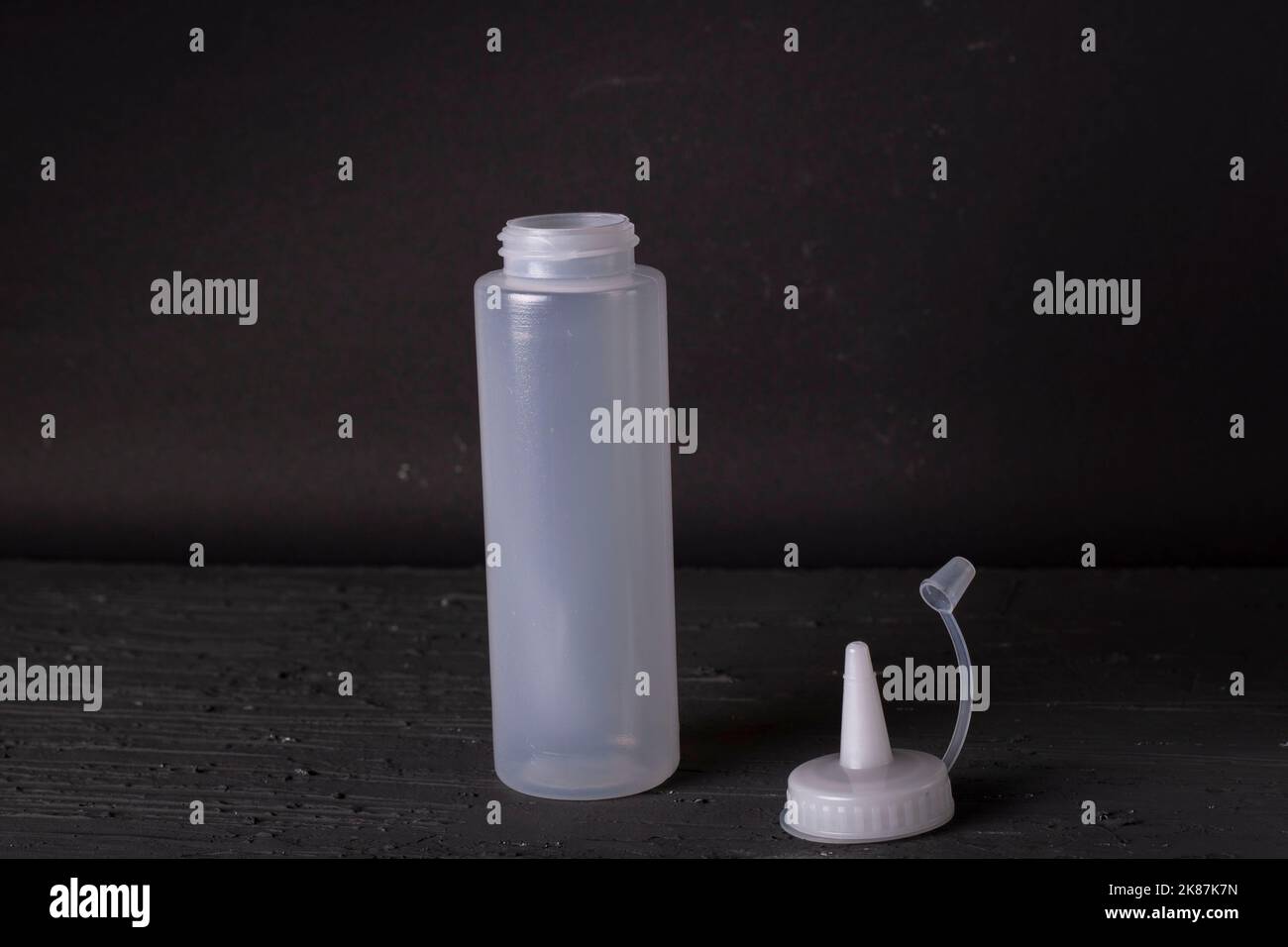 plastic sauce bottle on a black background Stock Photo