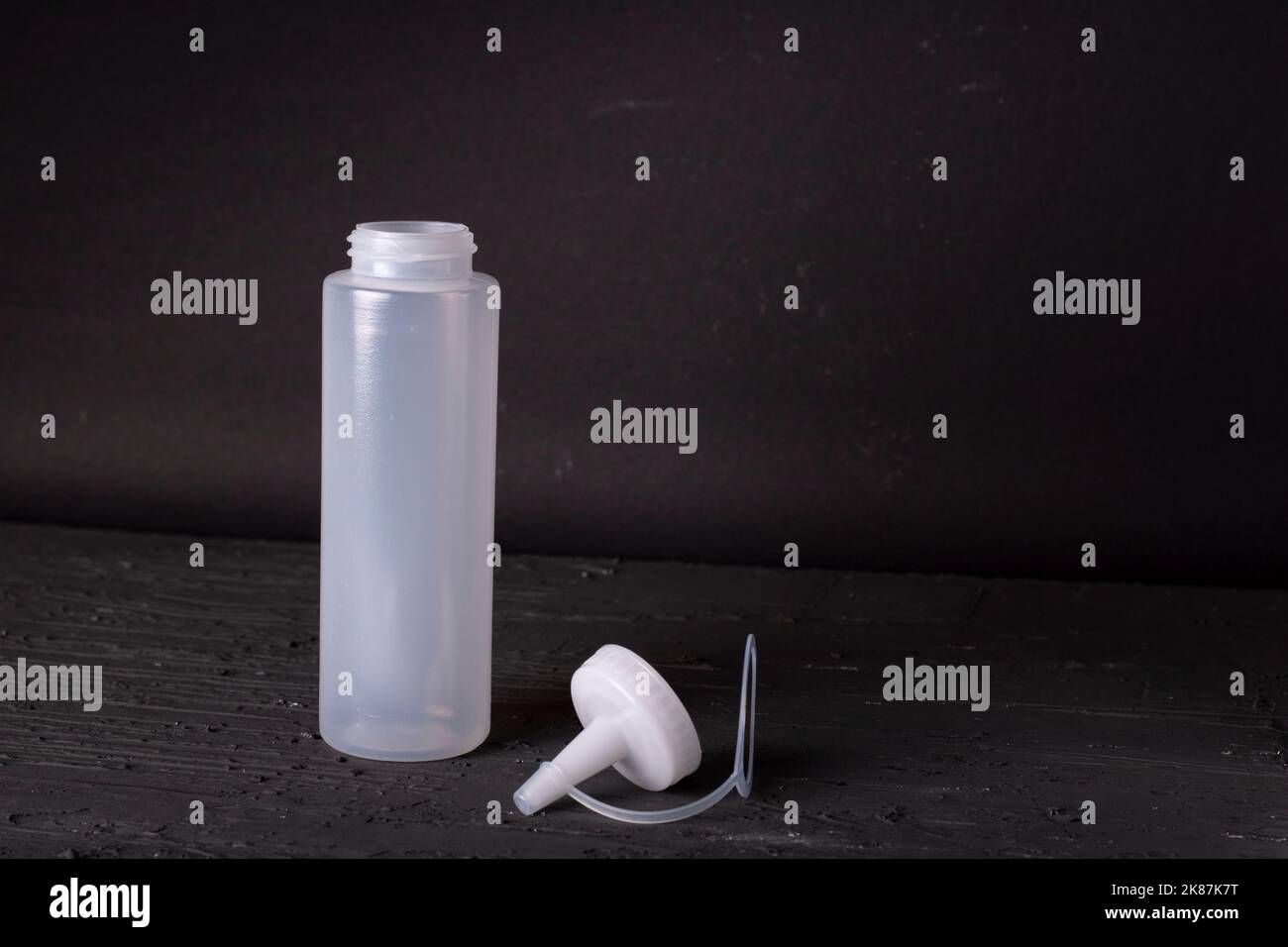 plastic sauce bottle on a black background Stock Photo