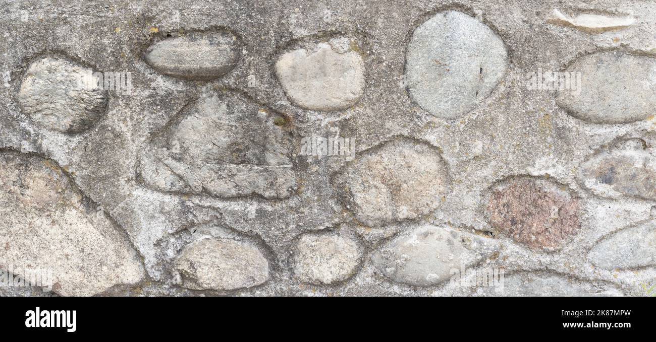 High quality old stone wall background. Front view with copy space. Stock Photo
