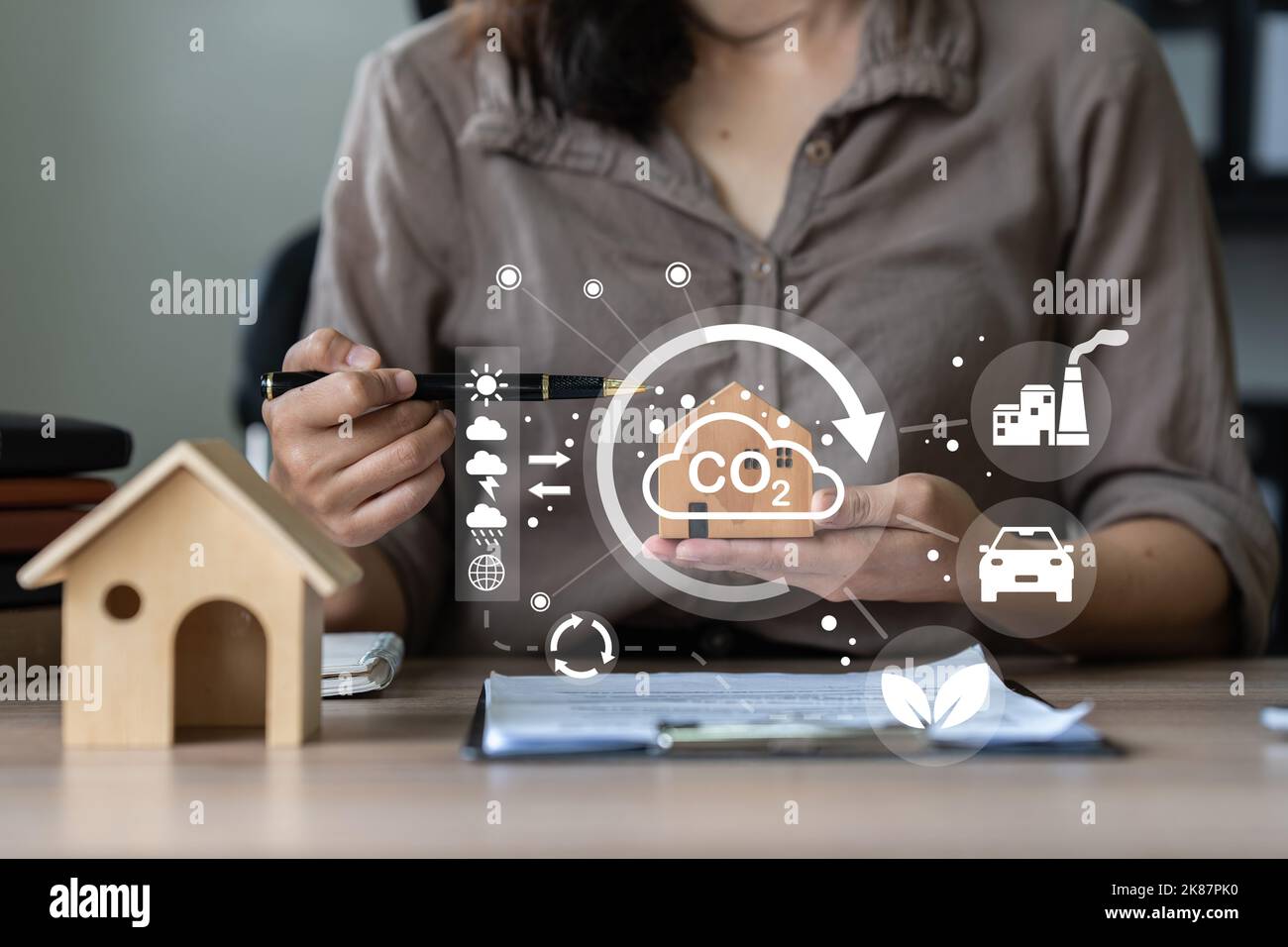 Real Estate Agent showing a energy project for future house. Green