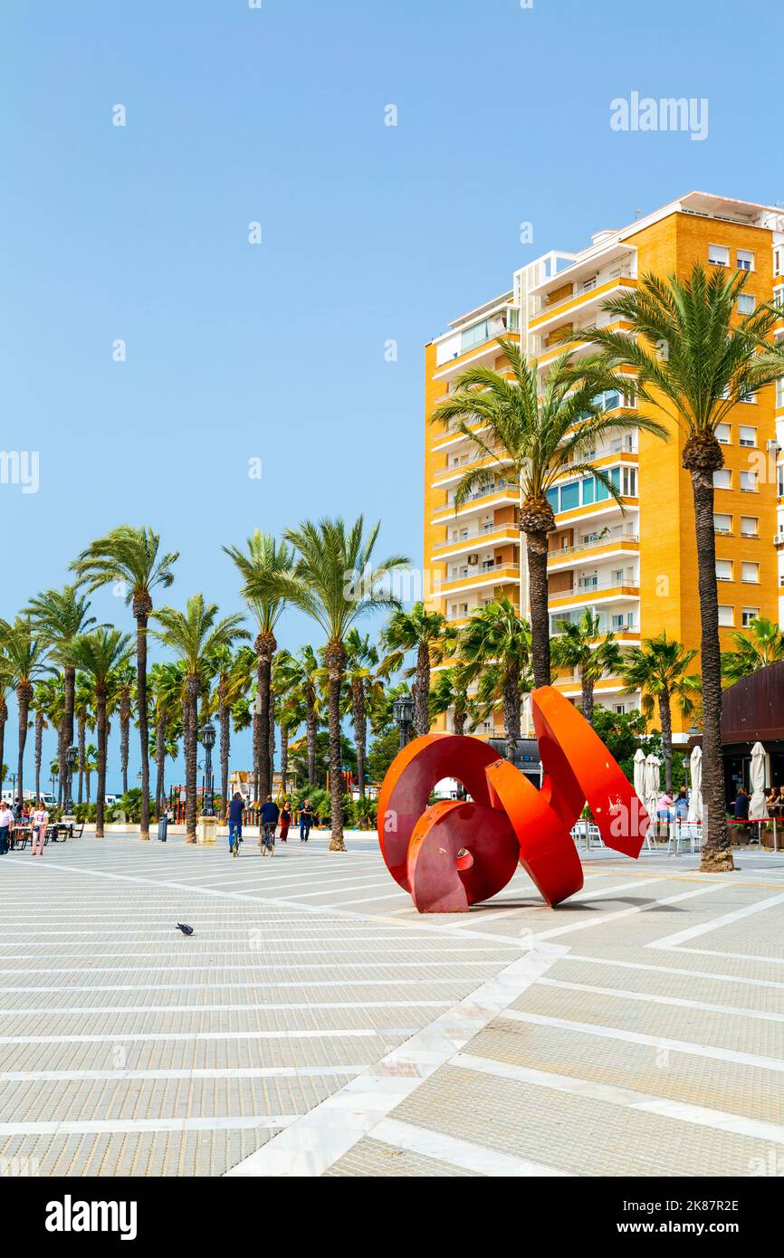 Seafront square with palm trees and contemporary sculpture at Avenue Duque de Najera, Cadiz, Andalusia, Spain Stock Photo