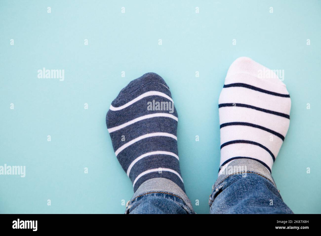Odd socks day concept. Mismatch socks at blue Stock Photo Alamy