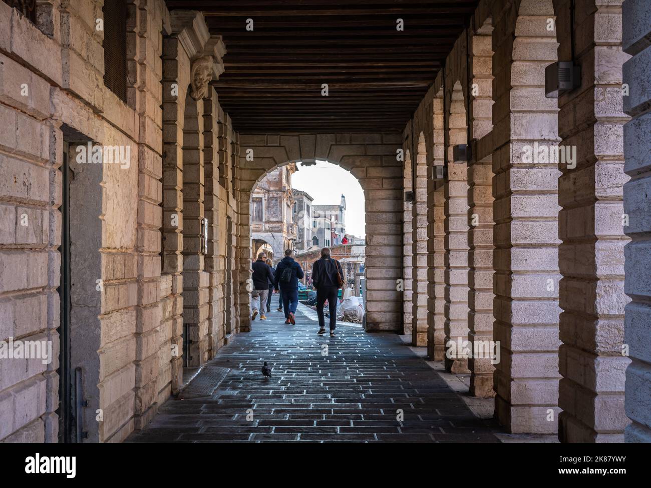 Street in the historic town of Chioggia, Venetian lagoon, Veneto region, northern Italy - people walking Stock Photo