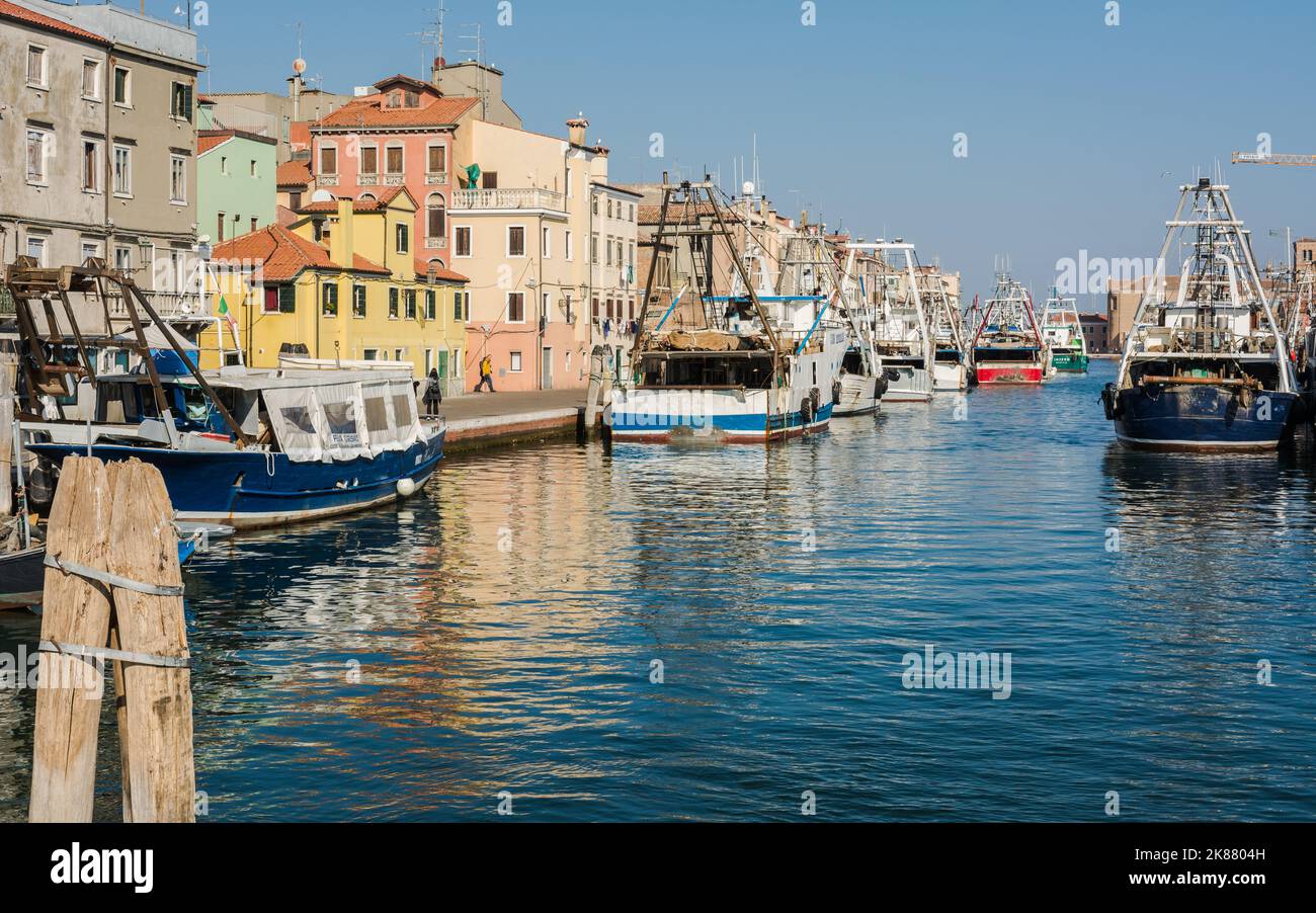 Fishing trawlers of Chioggia city, Venetian Lagoon, Verona province, Ital - boats docked along the canal Stock Photo