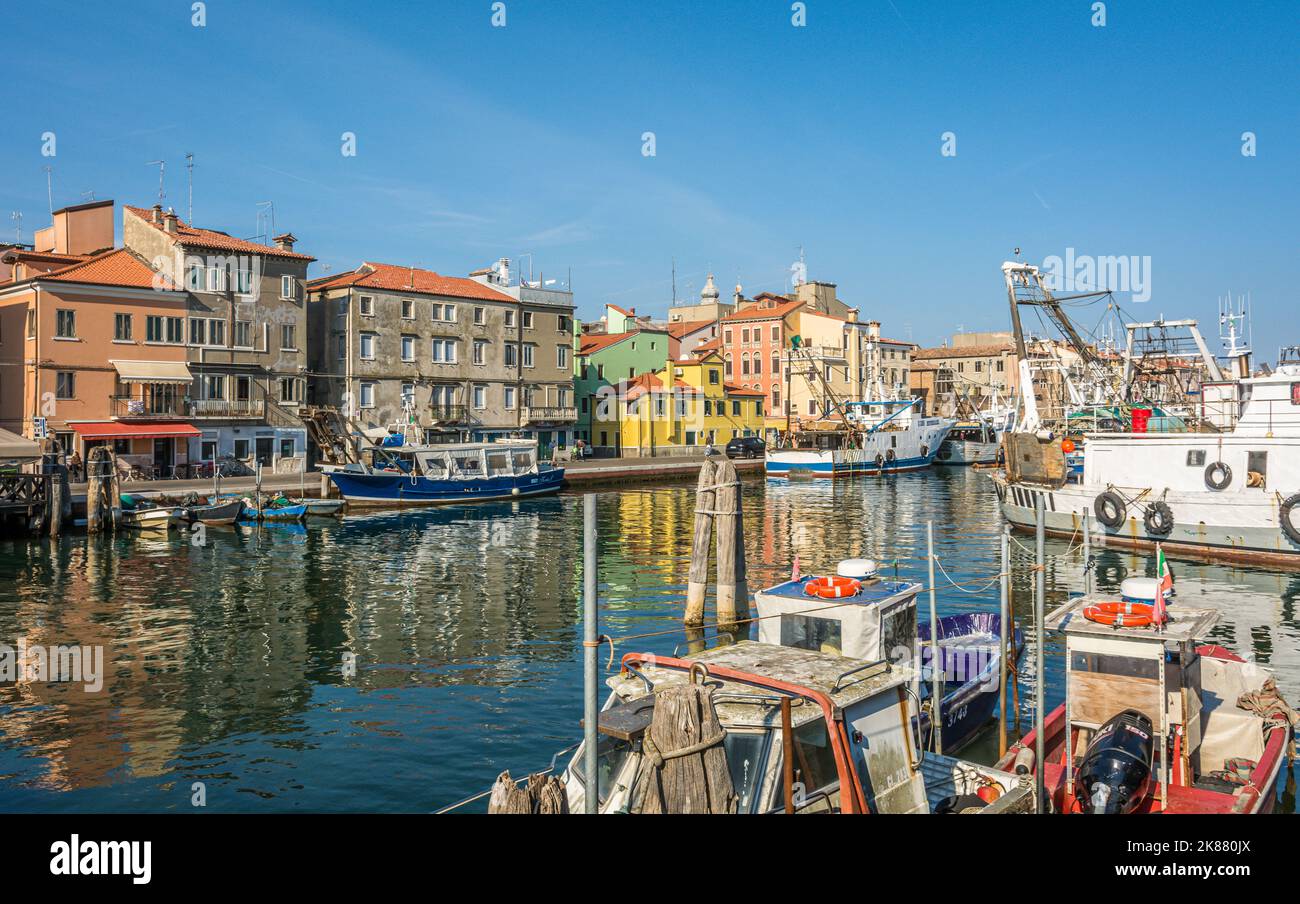 Boats moored in canal amidst buildings in Chioggia city, Venetian Lagoon, Verona province, northern italy Stock Photo