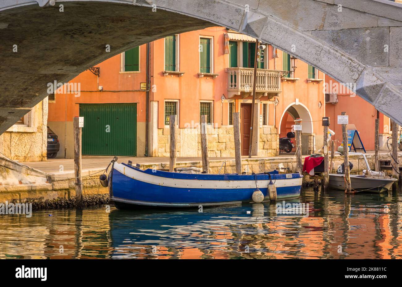 old blue wooden boat in the canal Chioggia city, little Venice, Veneto region, northern italy - Europe - glimpse of Chioggia city Stock Photo