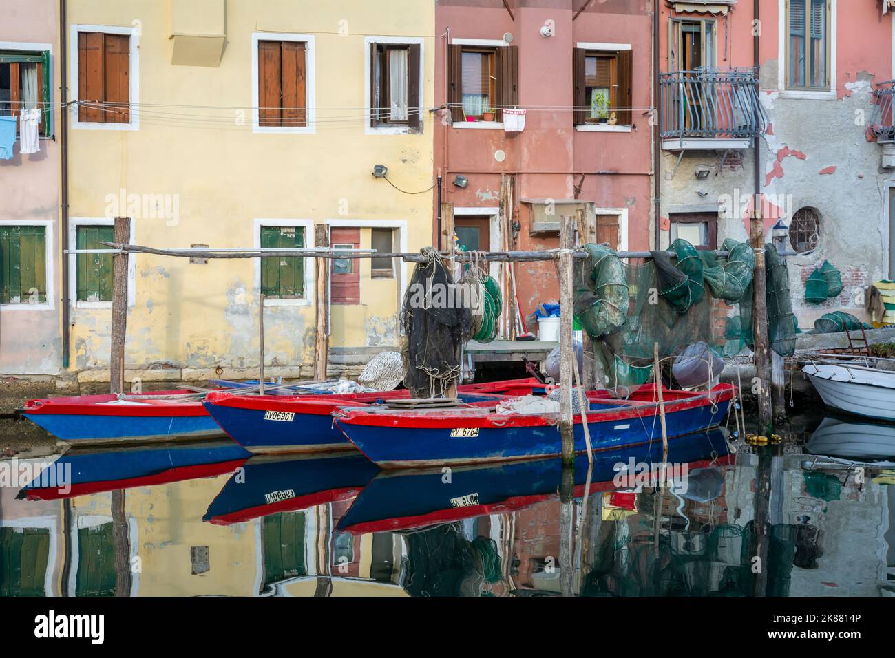 old blue wooden boats in the canal Chioggia city - Venetian Lagoon -  little Venice, Veneto region, northern Italy Stock Photo