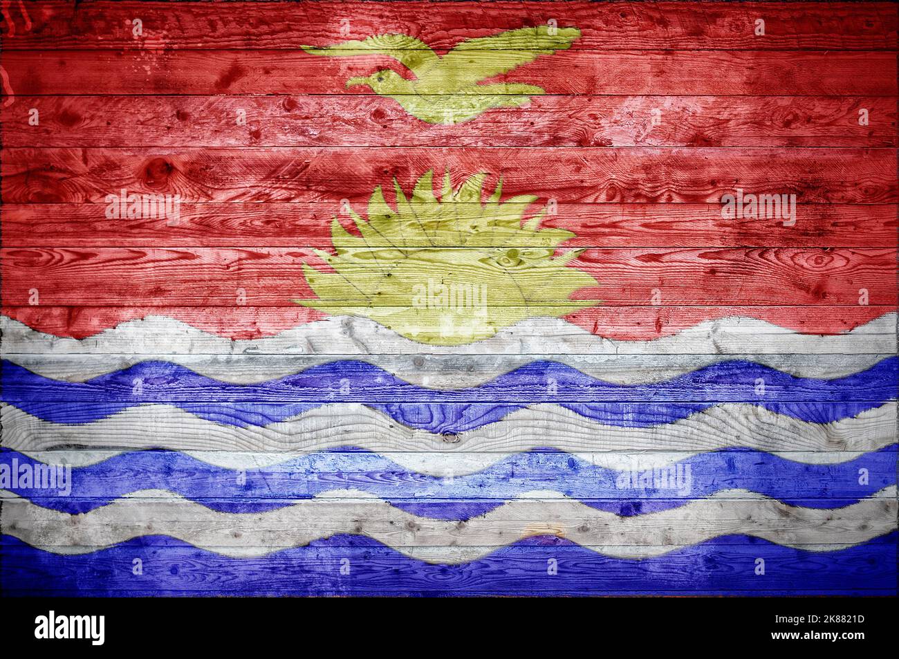 A vignetted background image of the flag of Kiribati painted onto wooden boards Stock Photo