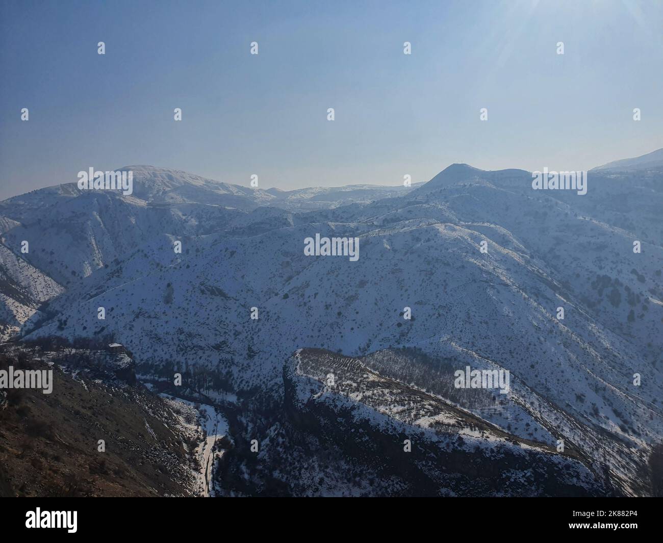 An aerial view of mountains covered in snow Stock Photo - Alamy