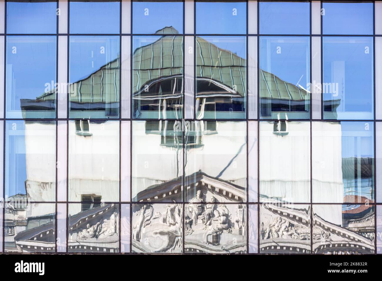 The Royal Theater and the Monnaie in Brussels, reflected in the windows of a building opposite. Stock Photo