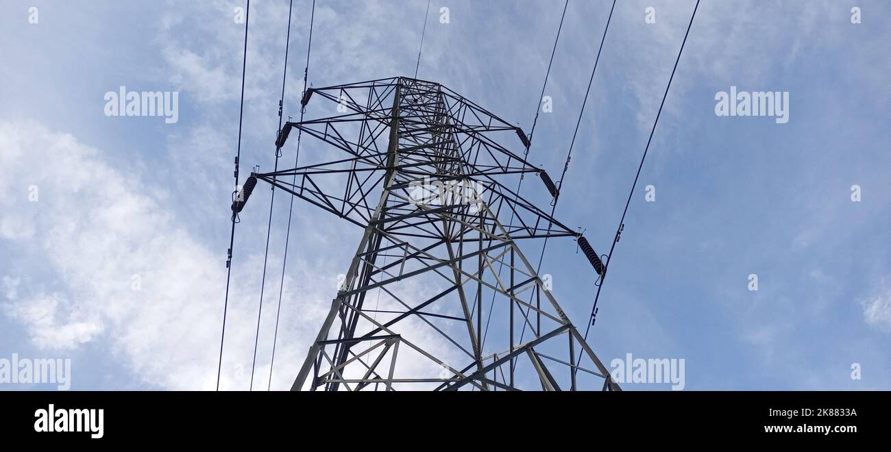 A low angle shot of an electric tower with high voltage Stock Photo - Alamy