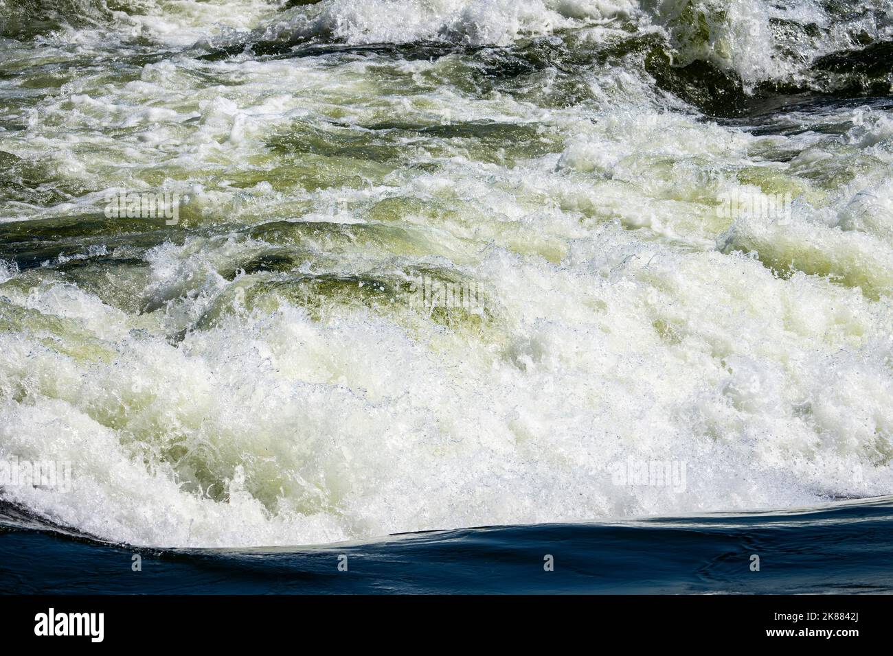 Fast-moving waters of the Lachine rapids in the St. Lawrence River. Stock Photo