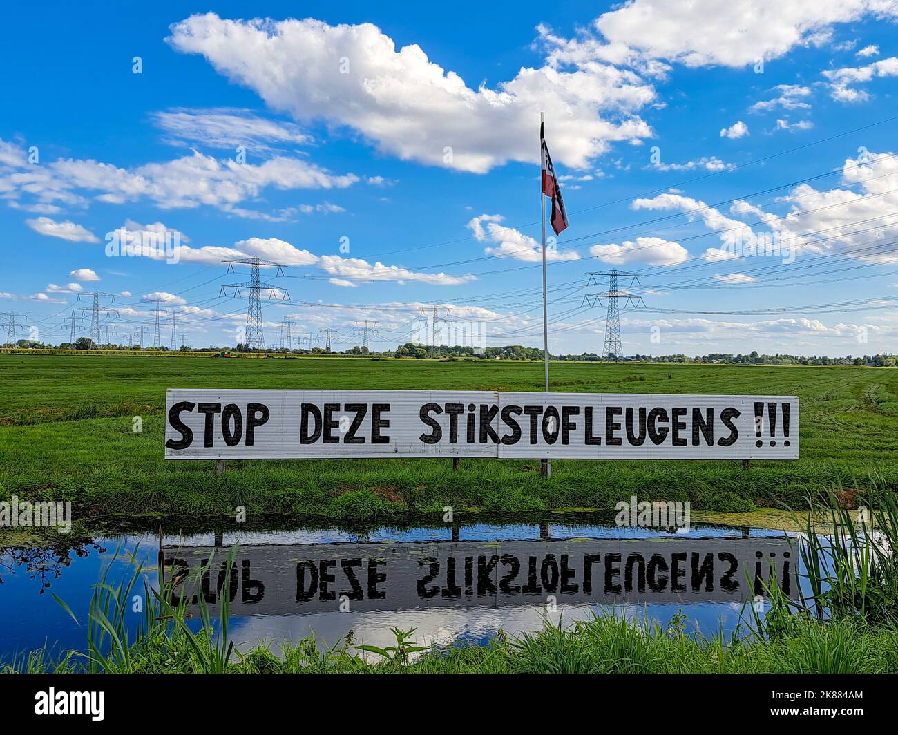 Protest signs and rows of flags upside down in Lekkerkerk along the