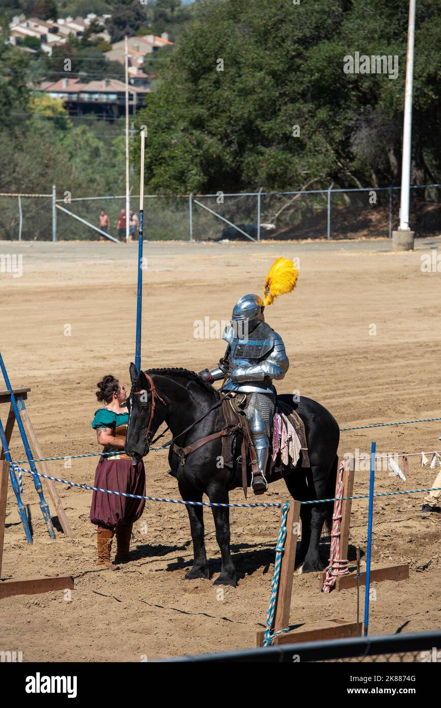 Folsom, CA, September 24, 2022. Armored knight on black horse at the Folsom Renaissance Faire. This fun historical festival was celebrated in the end Stock Photo
