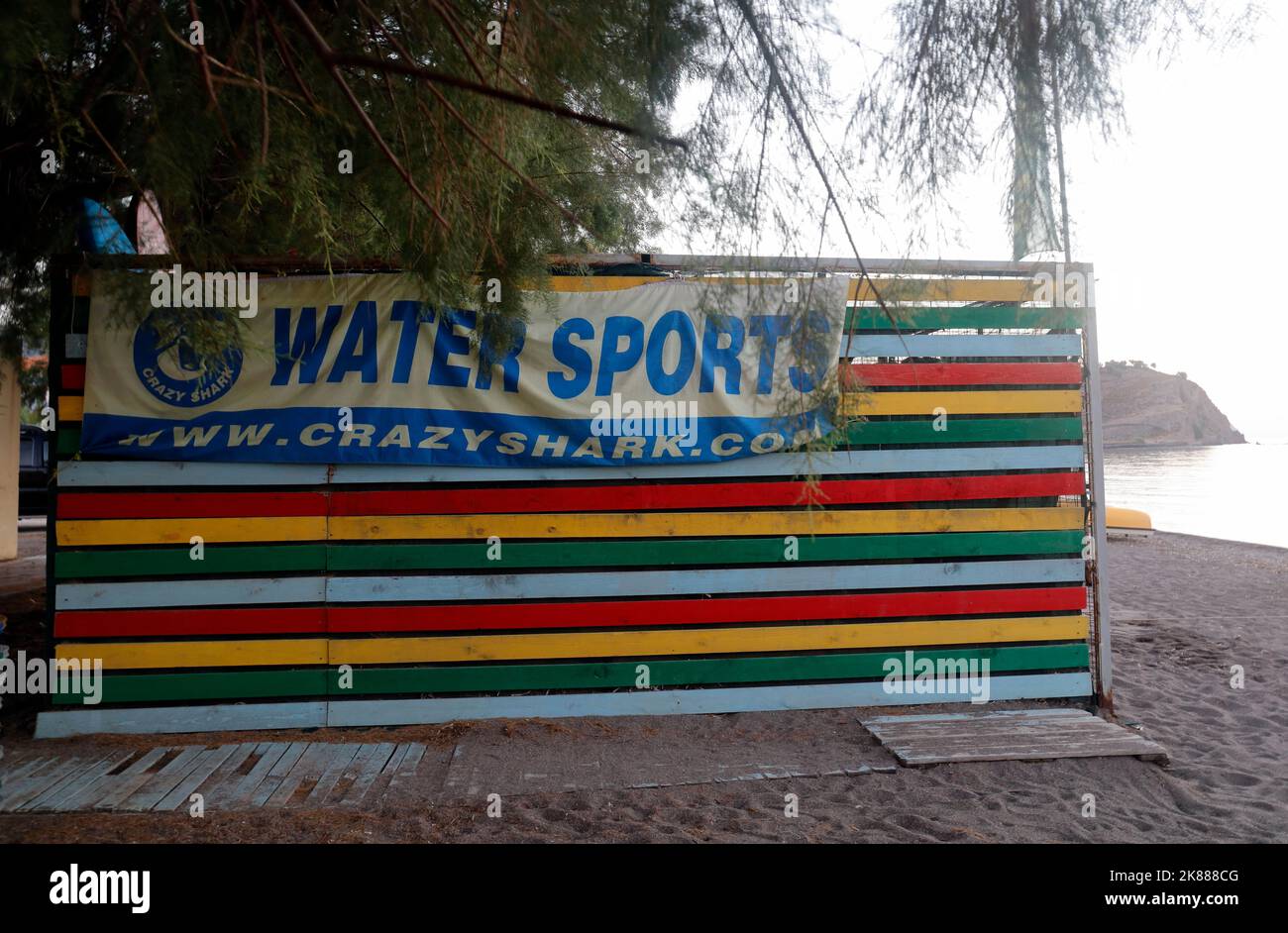 Colourful stripy water sports hut on Anaxos beach, Lesbos. September / October 2022. Autumn Stock Photo