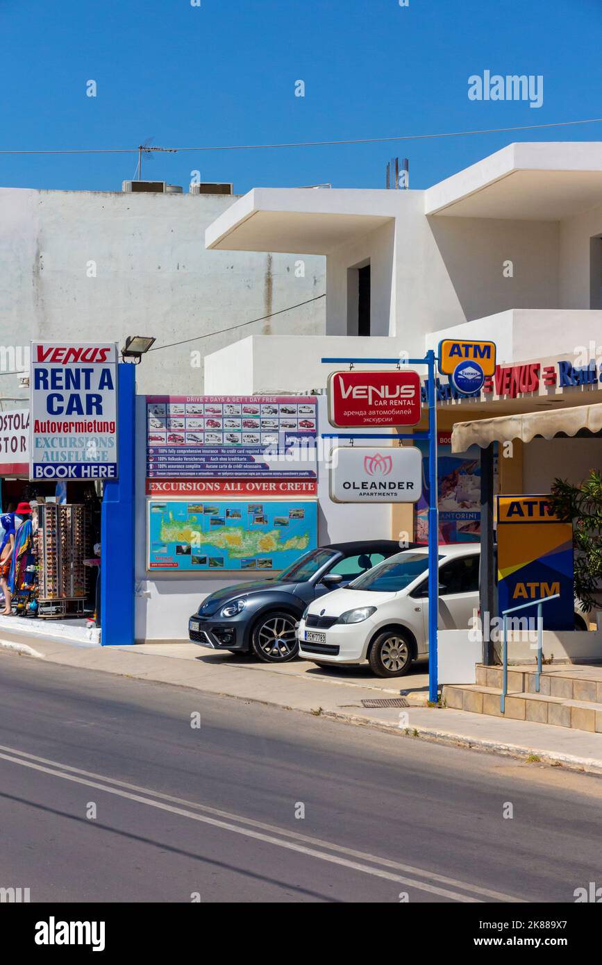 Car rental shop near the beach at Platanias near Rethymno or Rethymnon a resort town on the coast of northern Crete in Greece. Stock Photo