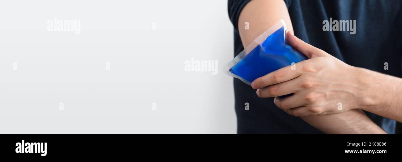 Ice Pack Or Hot Bag Compress On Injured Arm Stock Photo