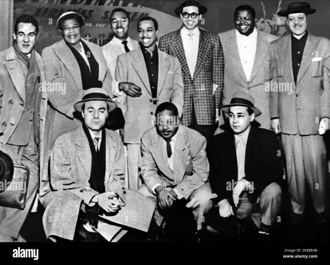 Gene Krupa, Ella Fitzgerald, Ray Brown, J.C. Heard, Barney Kessel, Oscar Peterson, Lester Young, Flip Phillips, Charlie Shavers & Willie Smith  Jazz At The Philmarmonic   01 June 1953   **WARNING** This Photograph is for editorial use only and is the copyright of The Film Company and/or the Photographer assigned by the Film or Production Company and can only be reproduced by publications in conjunction with the promotion of the above Film. A Mandatory Credit To The Film Company is required. The Photographer should also be credited when known. No commercial use can be granted without written au Stock Photo