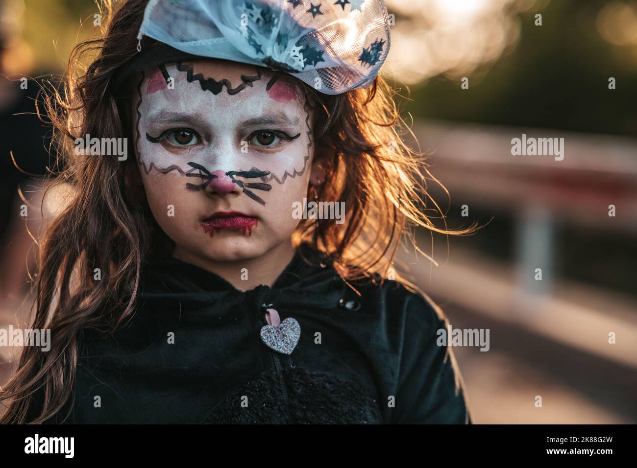 little girl dressed as black cats celebrating a Halloween party Stock ...