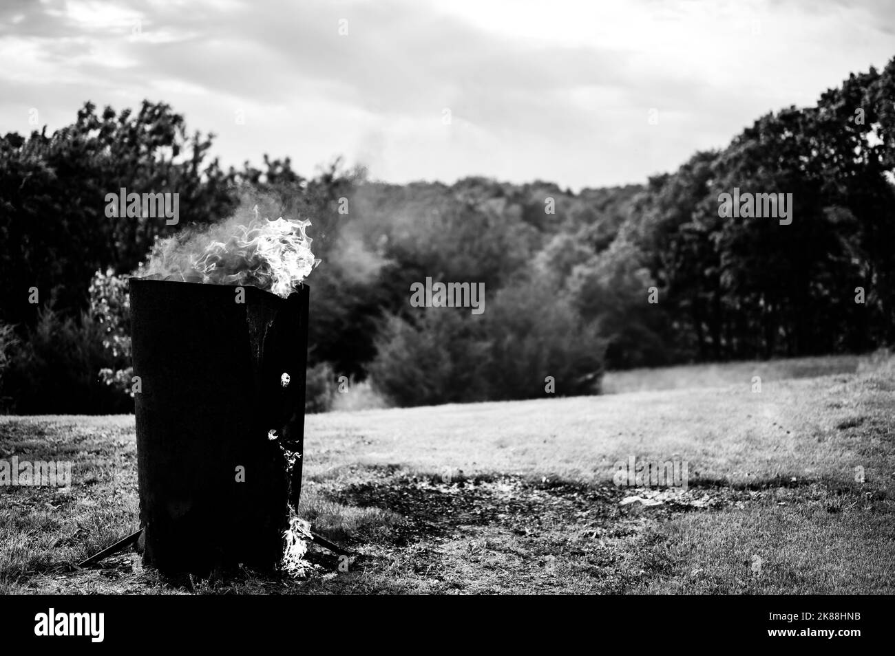 Burn barrel in a rural area used to incinerate trash and garbage Stock