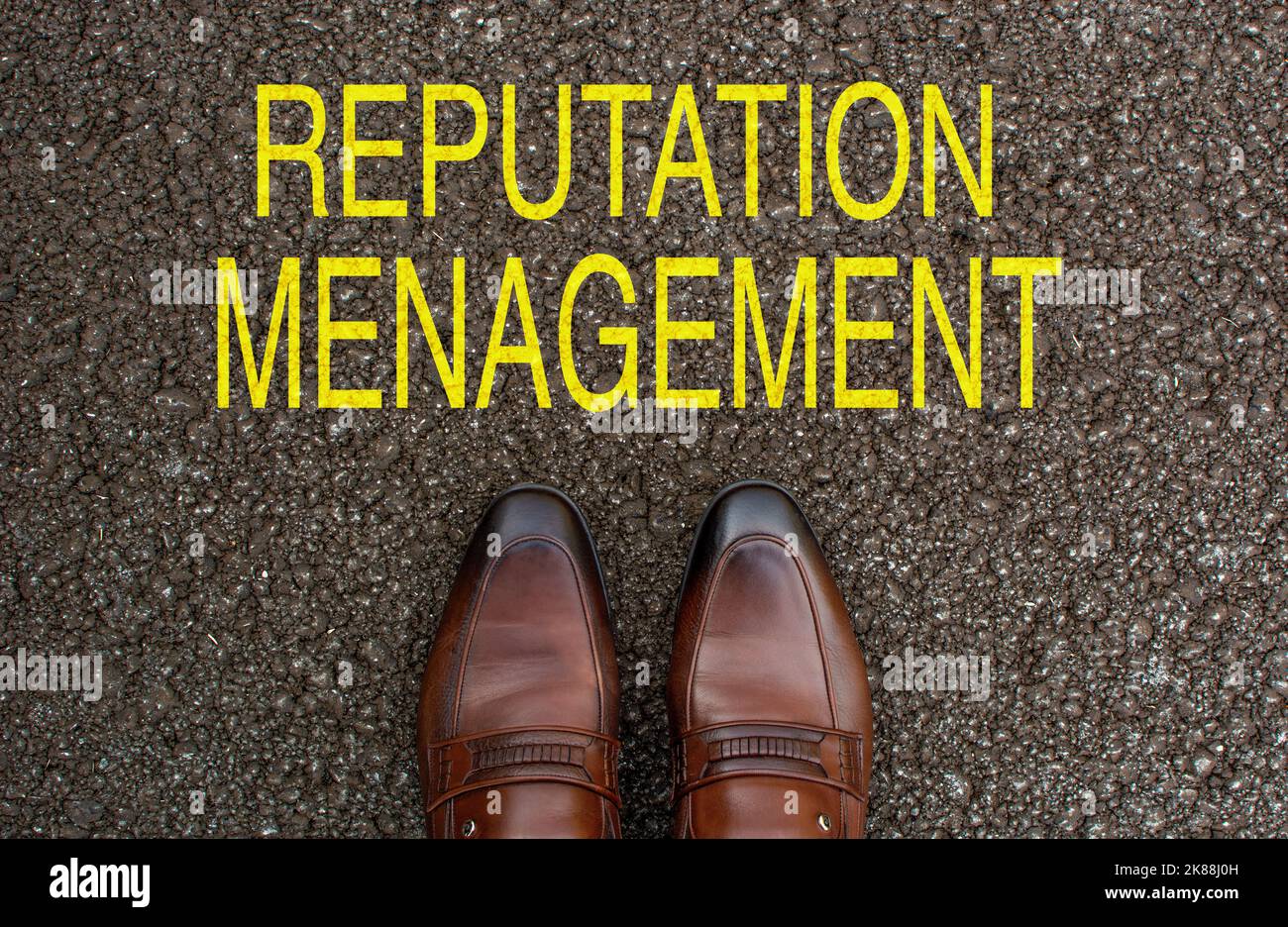 Top View of Business brown Shoes on the road with the text: reputation menagement Stock Photo