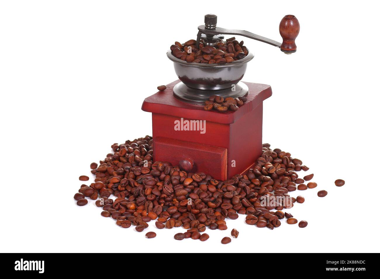 Manual coffee grinder in a heap of a coffee beans Stock Photo
