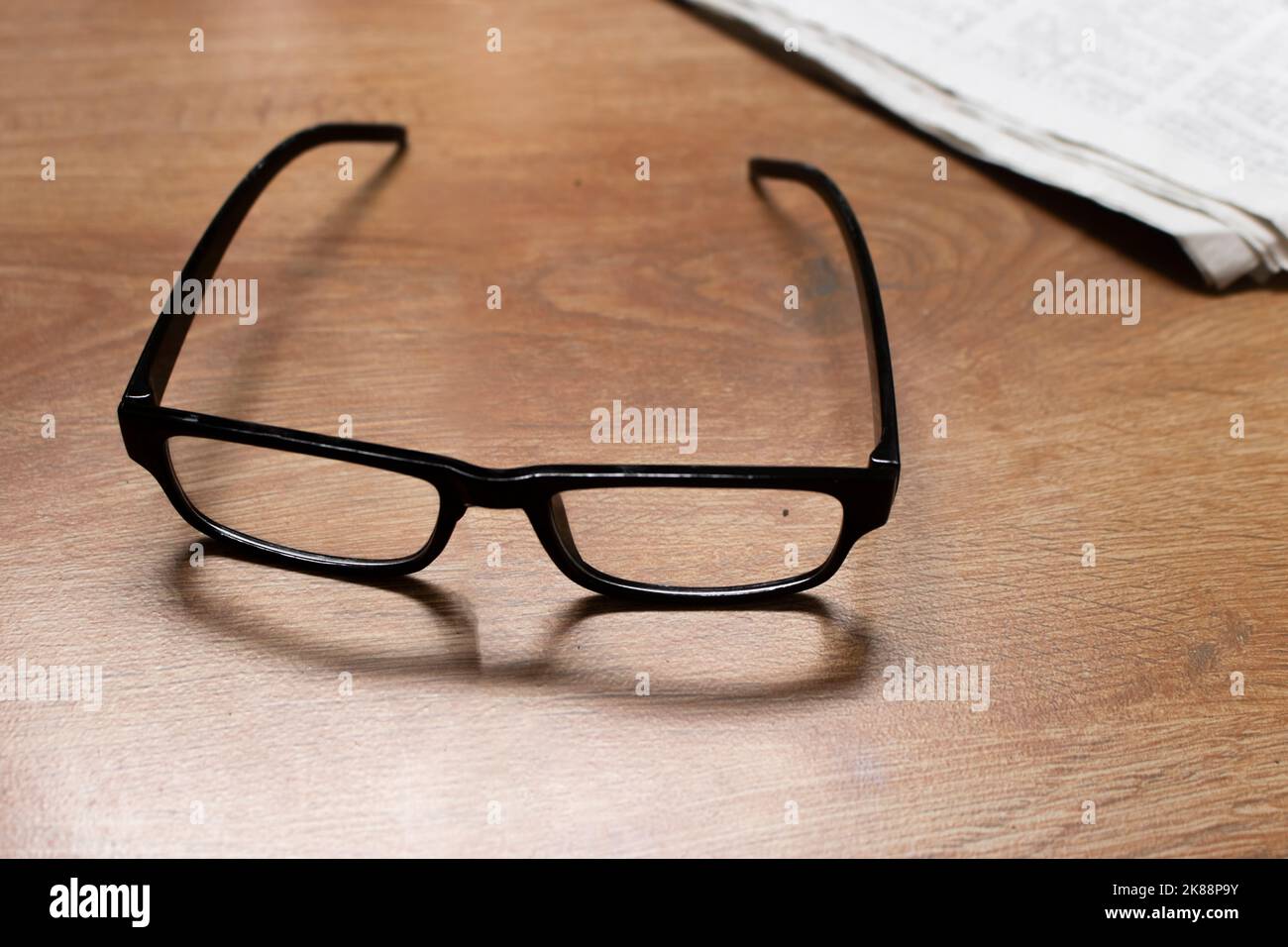 Reading glasses as a symbol of the aging human body. The concept of