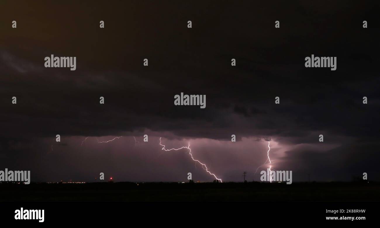 The striking lightning storm in the night sky Stock Photo - Alamy