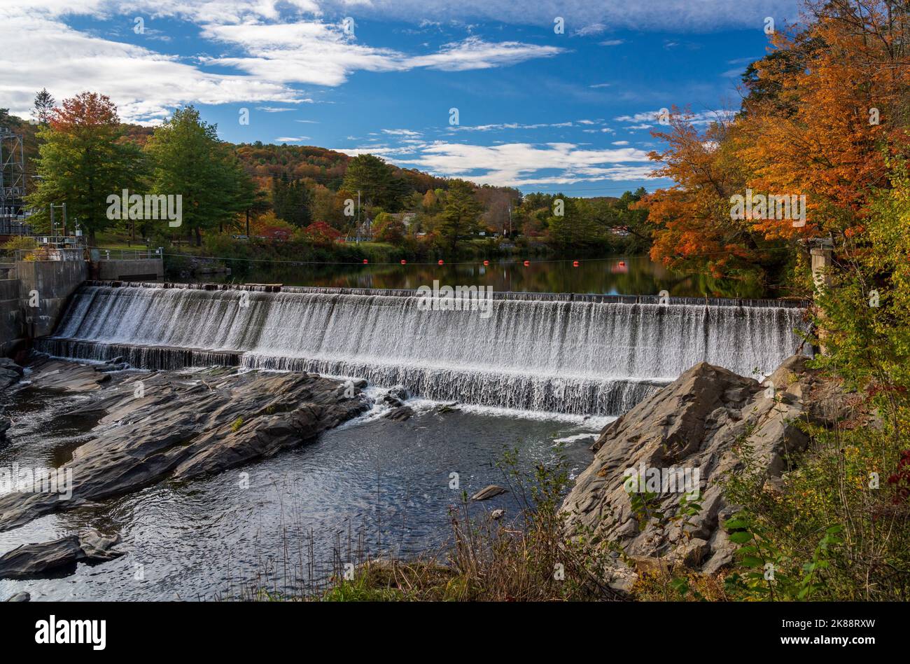 Ottauquechee river flows over weir into hydroelectric power station in