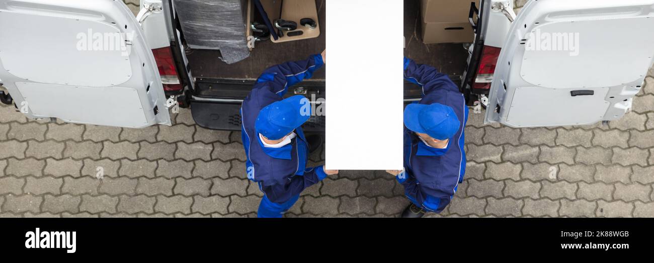 Furniture Transport Truck Service. Movers Unloading Delivery Van Stock