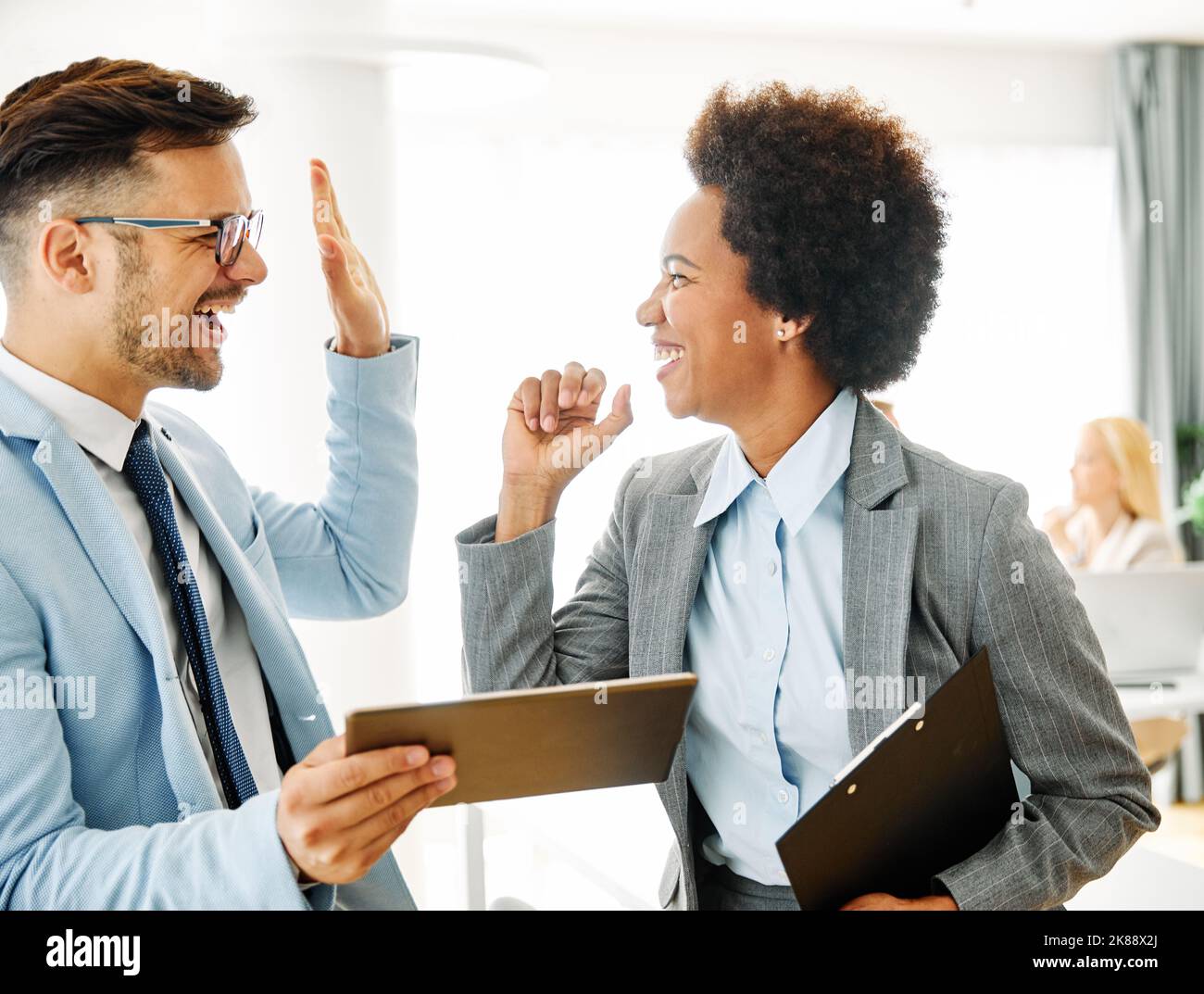 young business people meeting office teamwork victory win success corporate discussion laptop celebrating Stock Photo