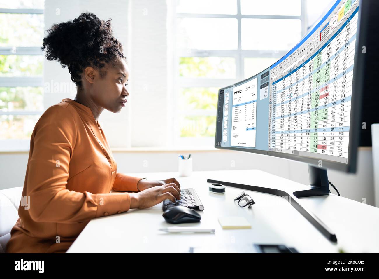 Medical Codes And Accounts Manager In Office With Bill Stock Photo - Alamy