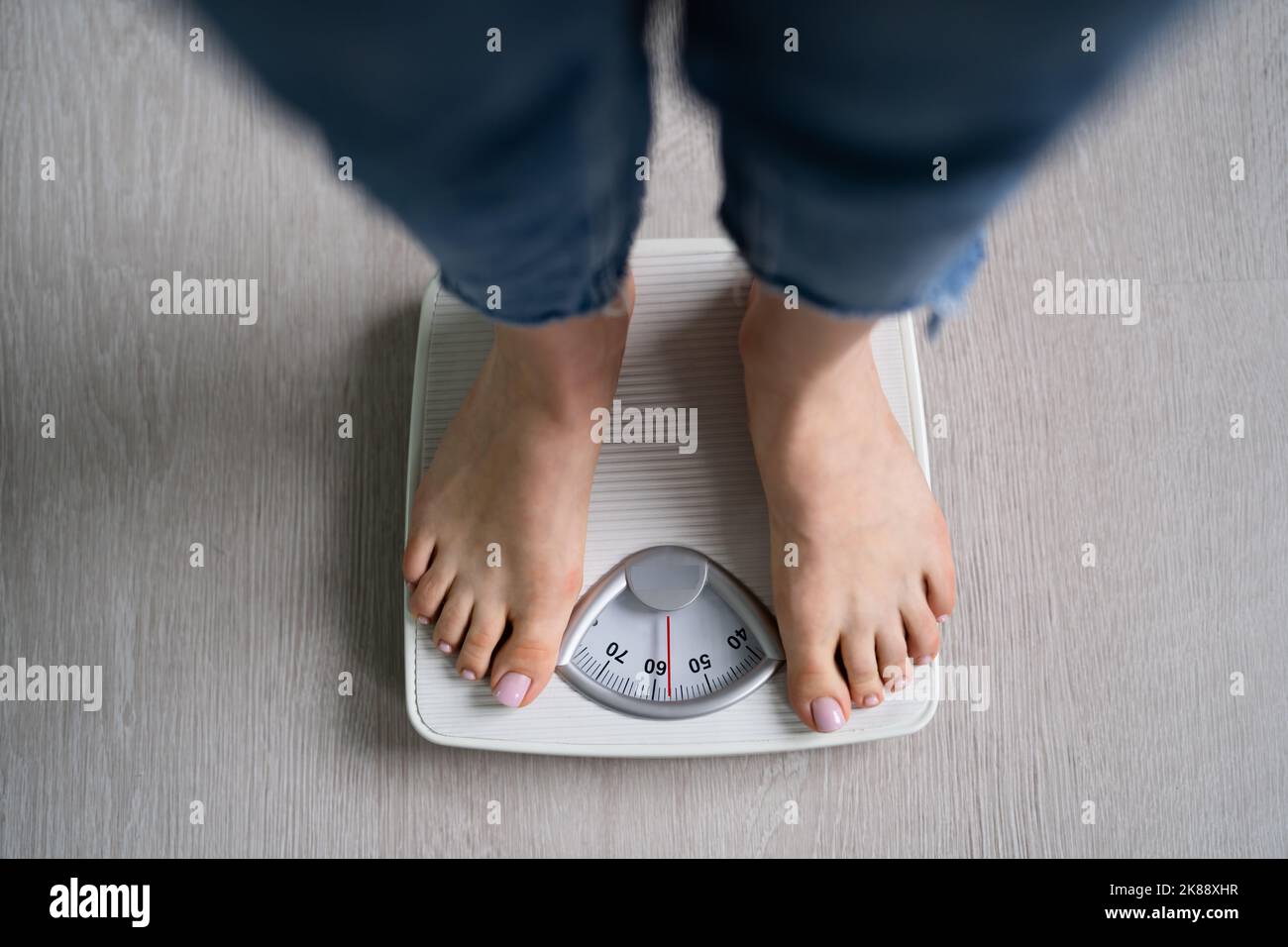 Woman on scale barefoot hi-res stock photography and images - Alamy