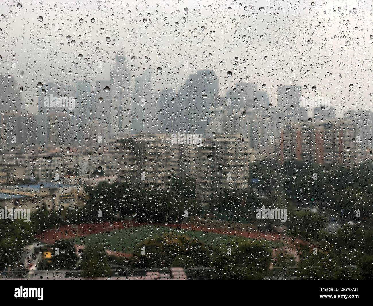 A view of the cityscape with high buildings on a rainy day from the ...